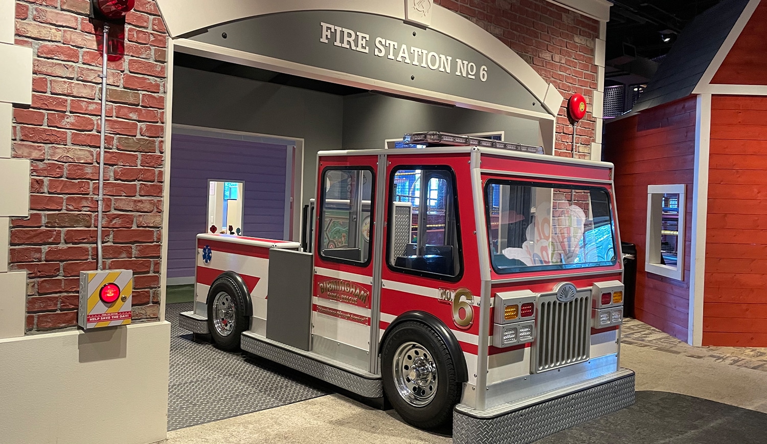 a fire truck parked in front of a building