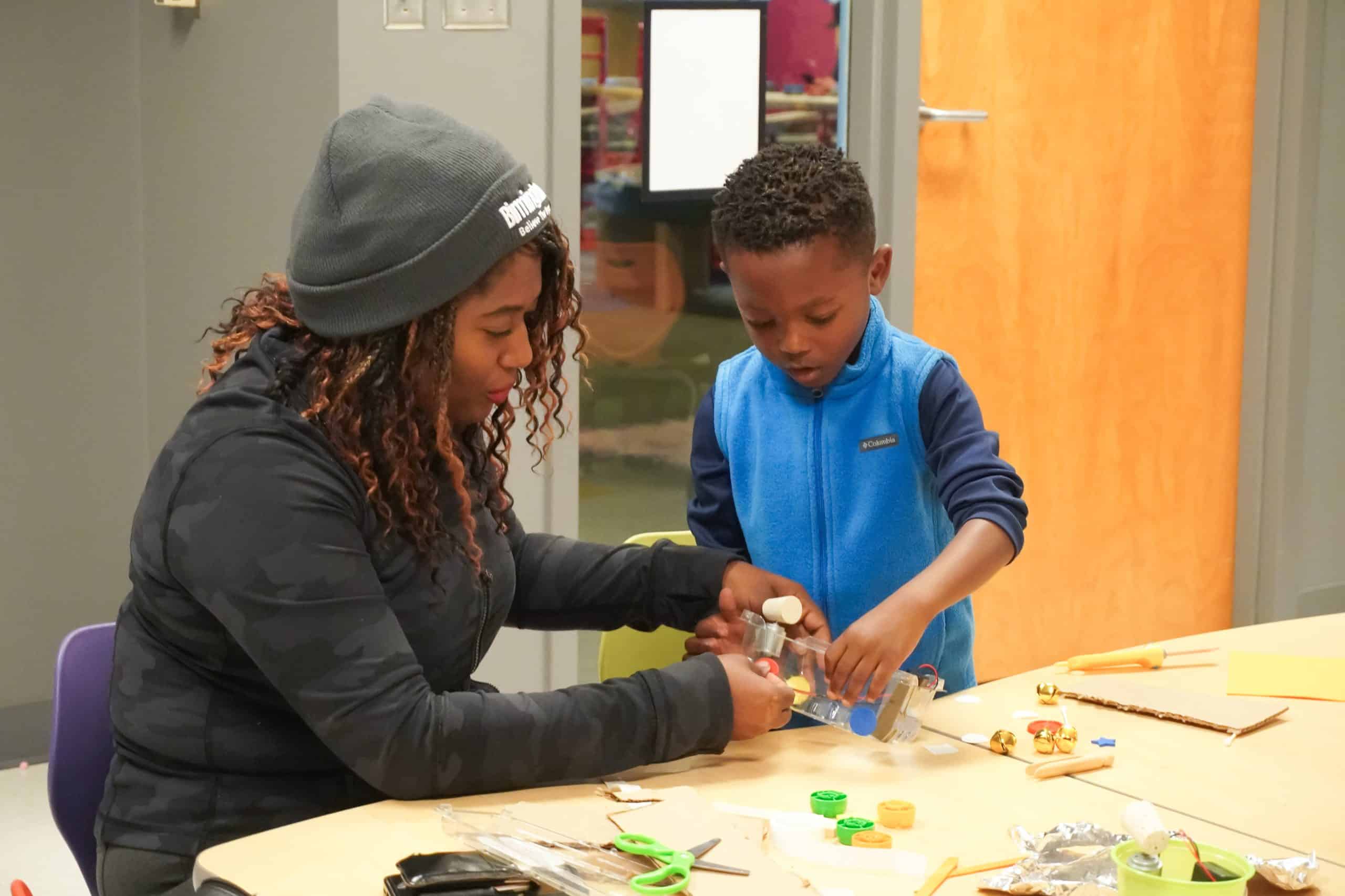 Woman and child, tinkering